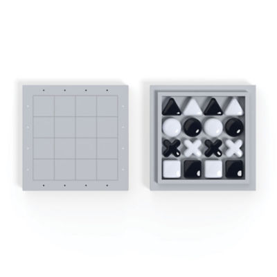 Top down view of a grey game board alongside black and white PlayStation Shapes pieces