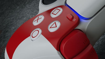 A close up of a red trigger and buttons on a A limited edition God of War DualSense controller
