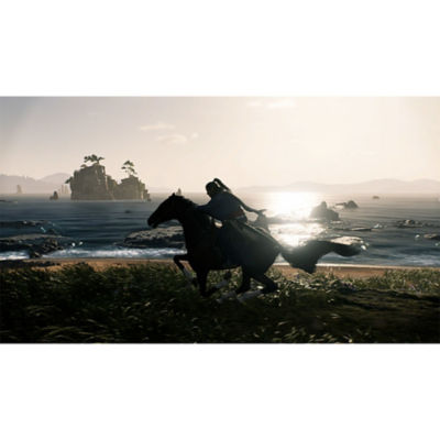 The silhouette of a samurai riding horseback alongside a beach