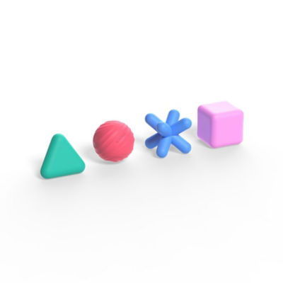 The green triangle, red circle, blue cross, and pink square silicone shapes in an angled row