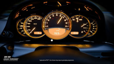 Gran Turismo - screenshot van de binnenzijde van een snelrijdende auto