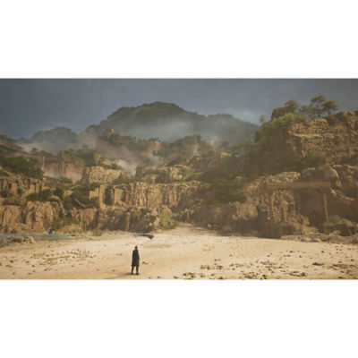 Lost Soul Aside - Capture d'écran montrant Kaser sur un terrain plat et aride, entouré de ruines ancestrales et de rochers bordés d'arbres.