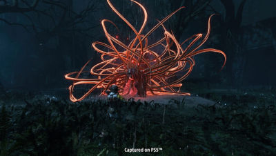 Selene vor einer großen orangefarbenen Alien-Kreatur mit vielen Tentakeln