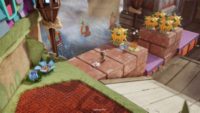 Sackboy court sur de grandes briques vers des obstacles orange hérissés de piques