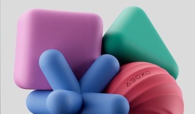 The pink square, green triangle, red circle and blue cross silicone shapes placed tightly together