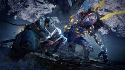 PS4 Nioh 2 protagonist holds a hatchet in each hand and prepares for battle against a demon monster.