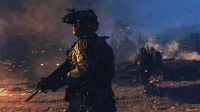 PS4 Call of Duty: Modern Warfare II operator fires a rifle with advanced night vision goggles on