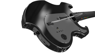 Angled close-up of the black Riffmaster guitar controller showing its whammy bar and control buttons.